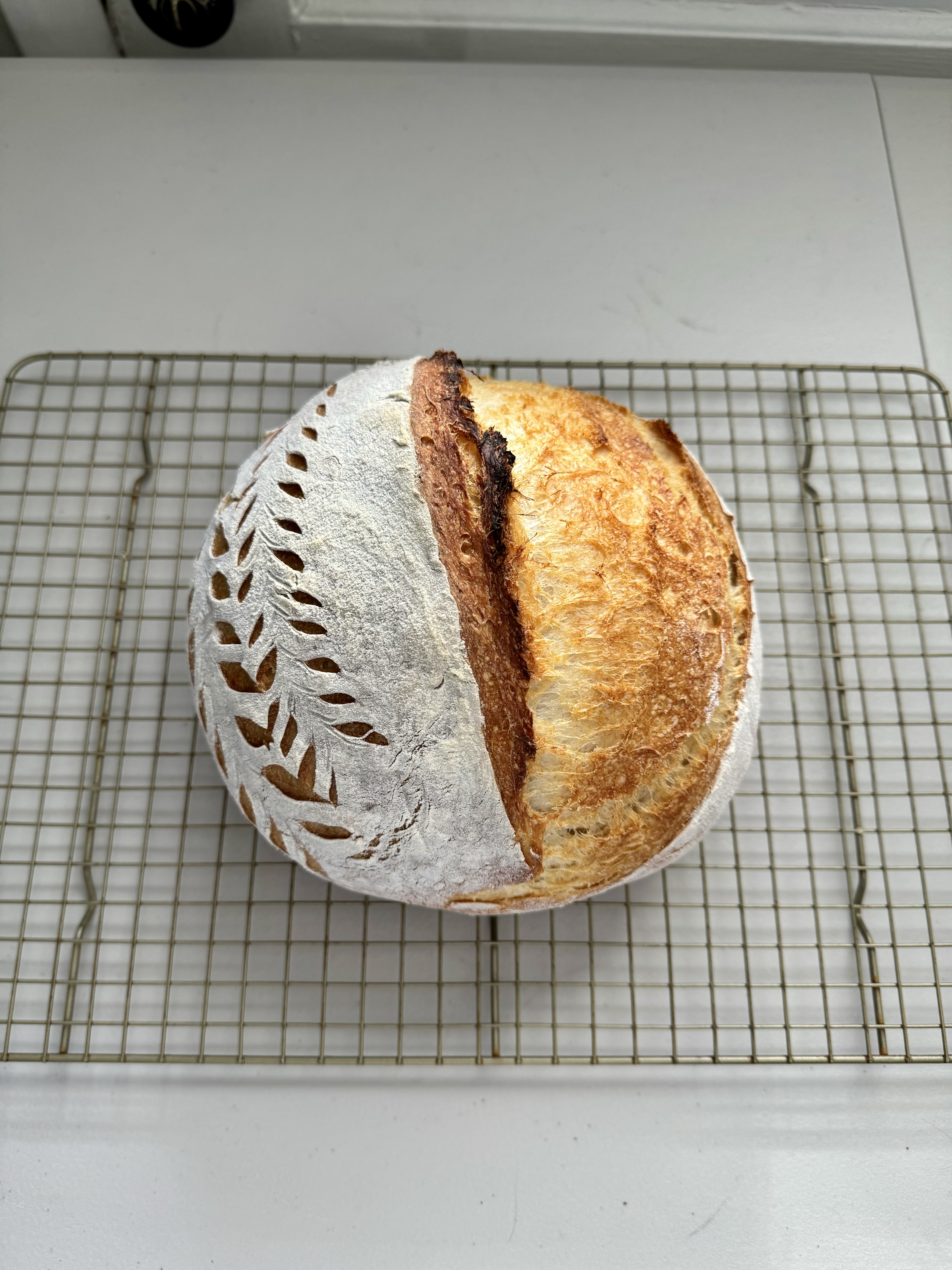 Traditional sourdough with decorative scoring